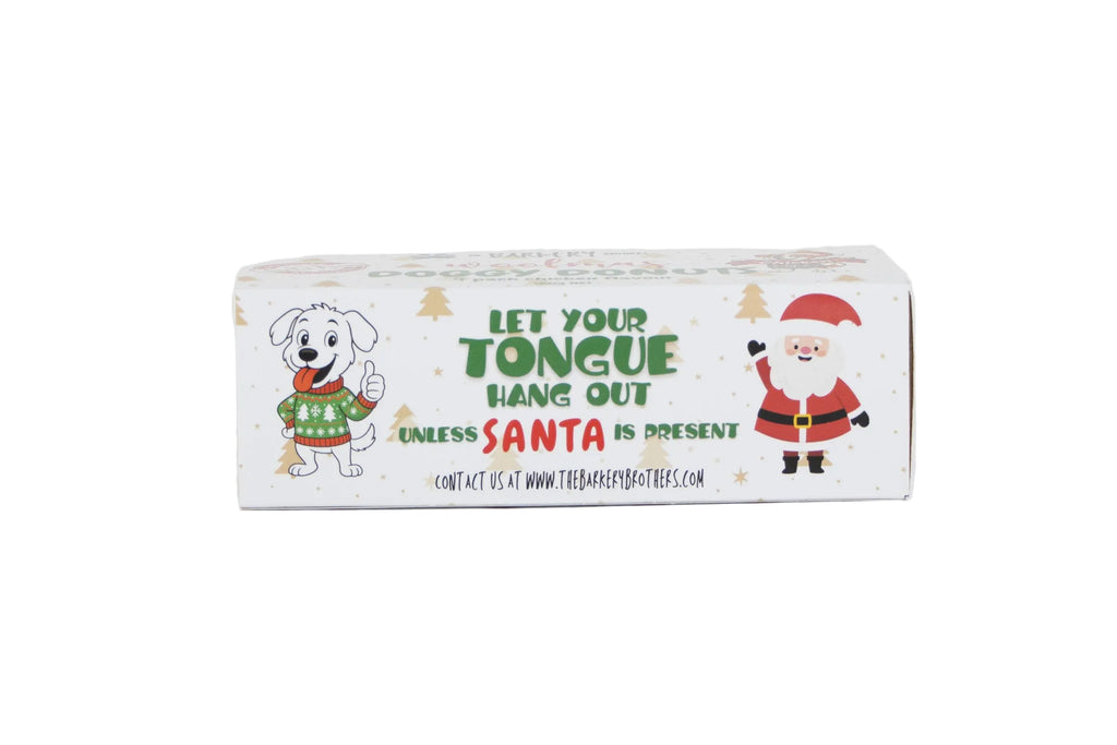 A rectangular white product box with Christmas-themed illustrations, including a dog in a green sweater and Santa Claus, with the text 'LET YOUR TONGUE HANG OUT UNLESS SANTA IS PRESENT' on a white background.