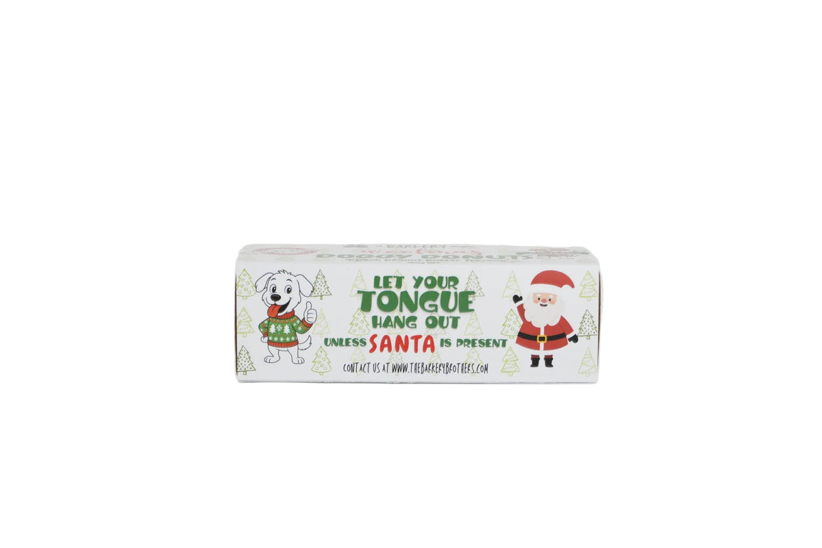A rectangular novelty product box with a white background and Christmas-themed illustrations, including a dog in a sweater and Santa Claus, with the text 'LET YOUR TONGUE HANG OUT' and 'CALENDAR IS PRESENT'.